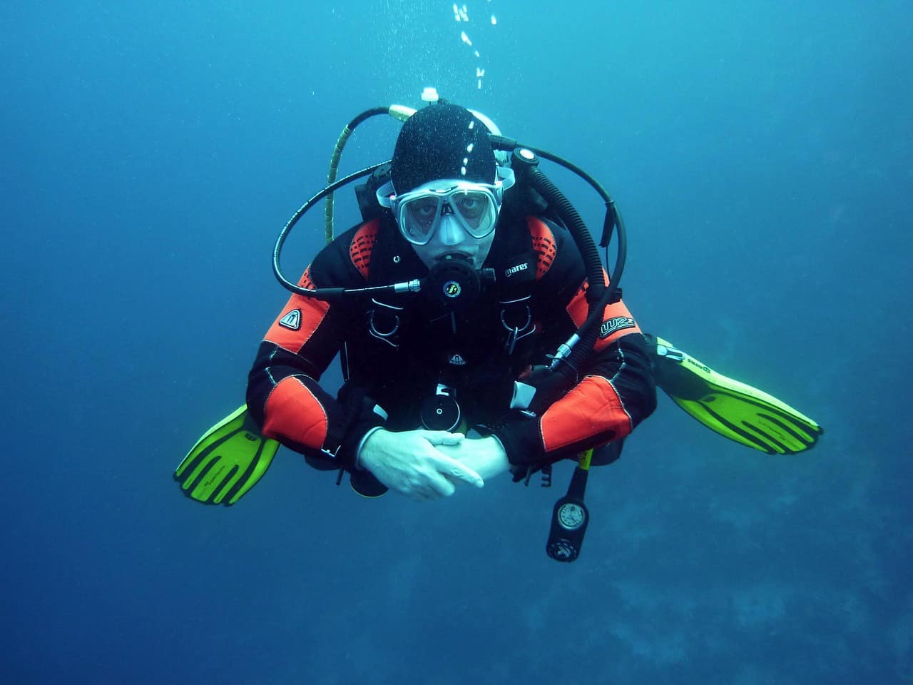 Diver exploring a Goa reef in clear blue water